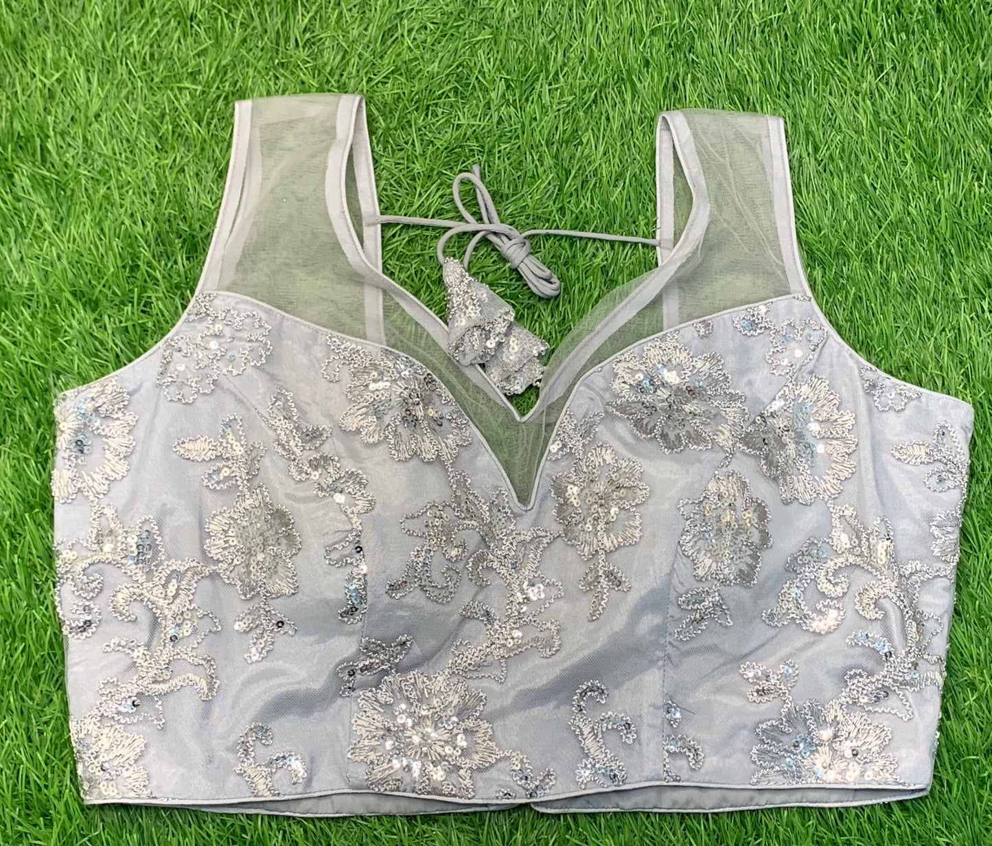 Grey neck with net work thread n sequence sleeveless blouse