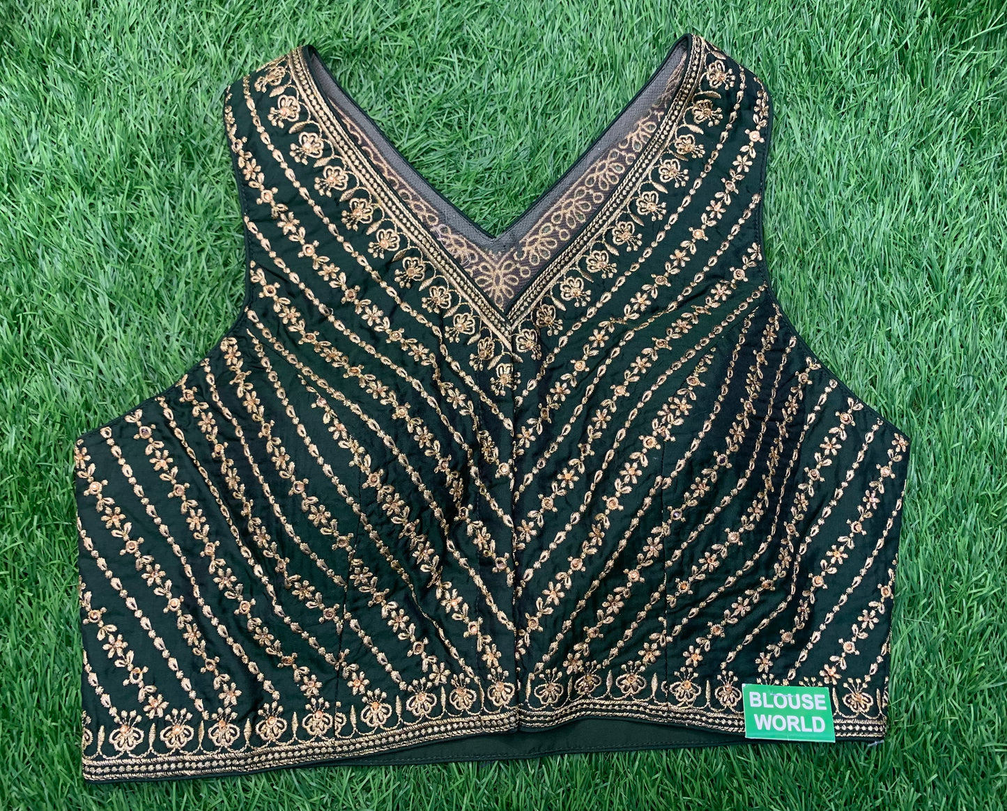 Bottle green sleeveless blouse