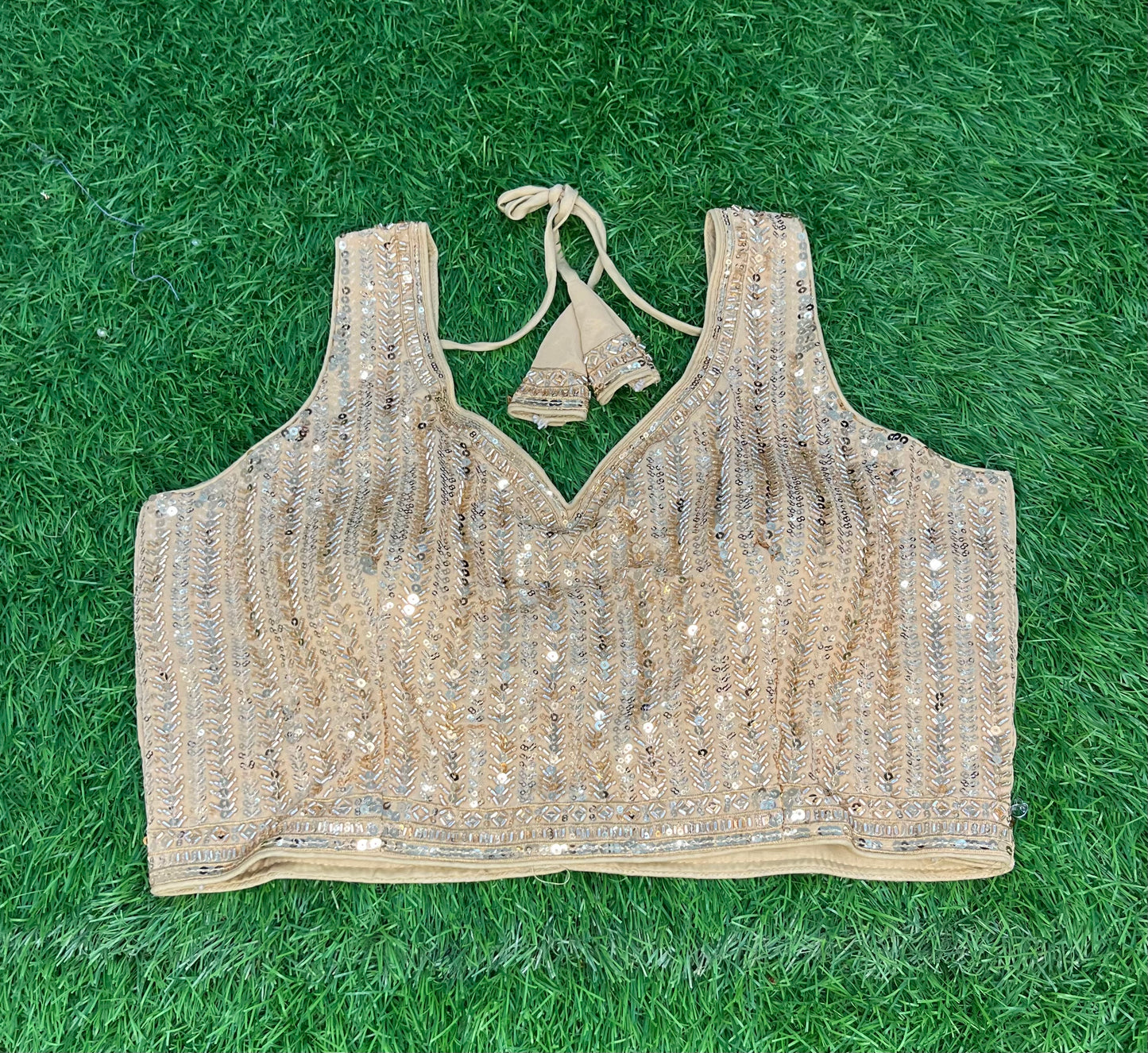 Golden blouse with hands