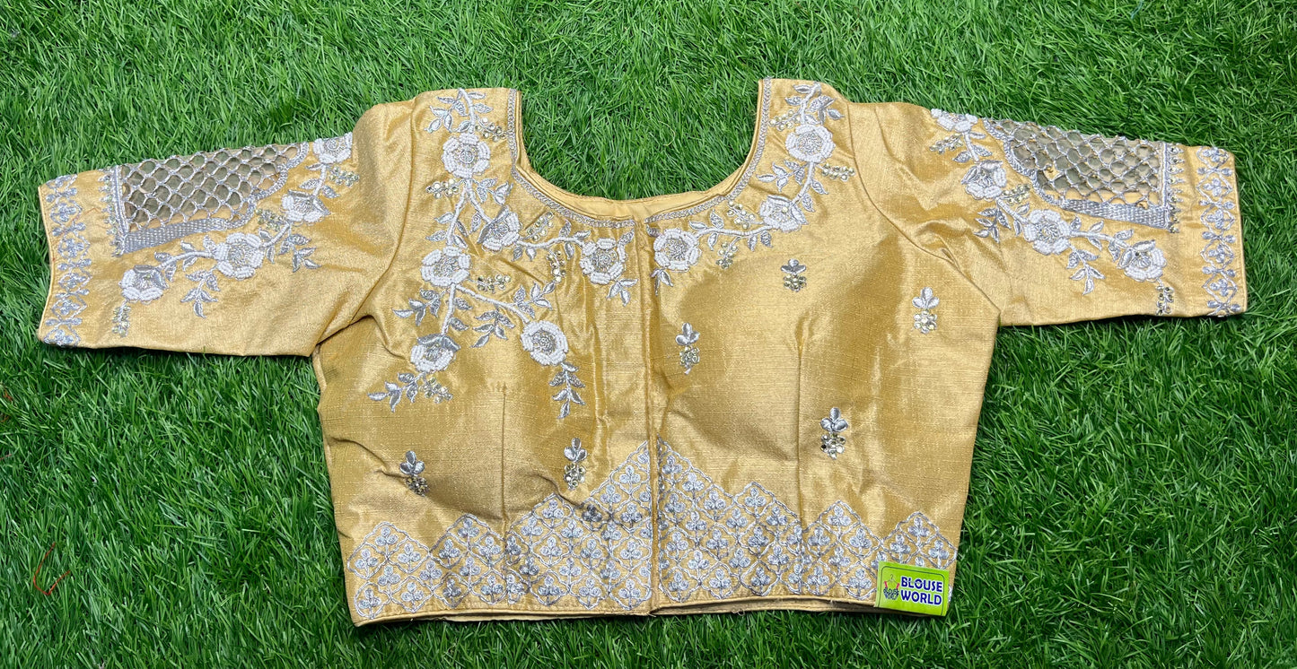 Golden base silver work cut work design blouse