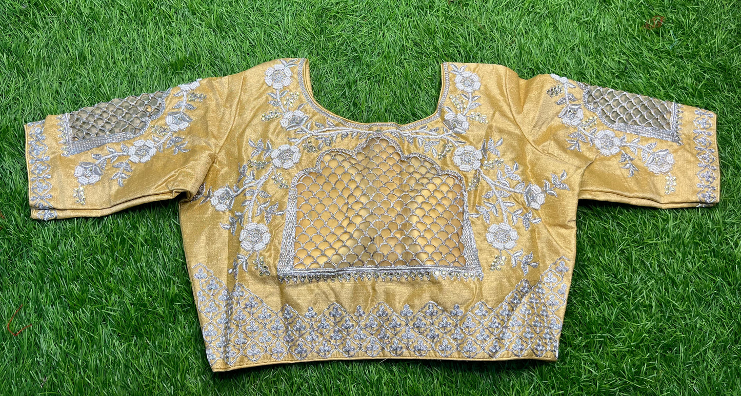 Golden base silver work cut work design blouse