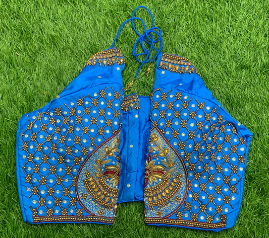 Blue fairoza red colour thread work with golden zari n white stone handwork blouse