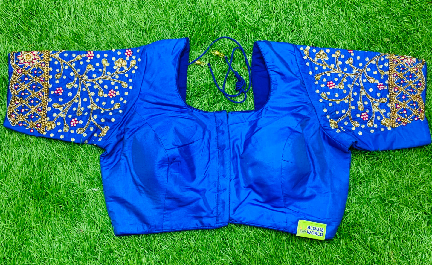 Sky blue maggam hand work with gold zari blouse